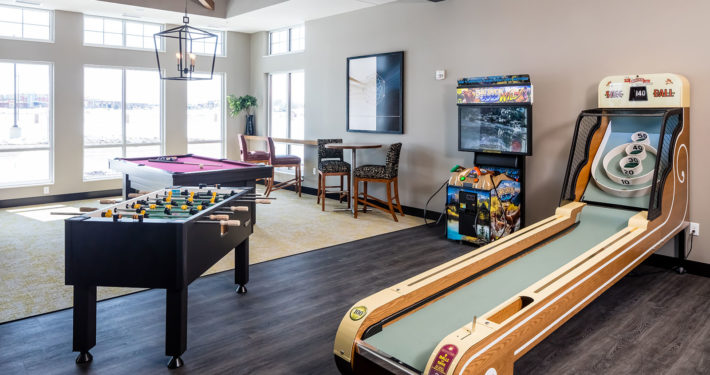 Gameroom with skee ball, pool table and foosball